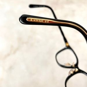 Coach Glasses. Beautiful black and gold frame. Like new, almost never used.